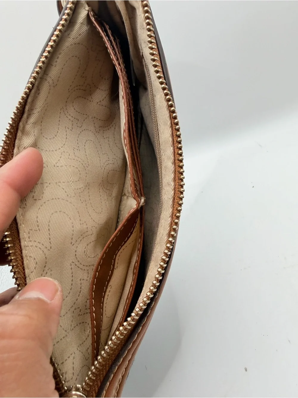 True Religion Denim Wristlet with Tan Trim and Gold Logo